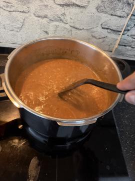 Final daal being stirred
