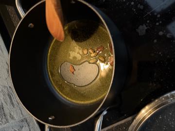 Spices releasing aroma in ghee