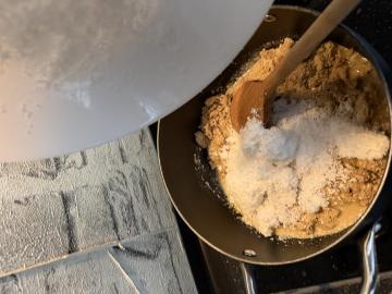 Adding coconut to the pan